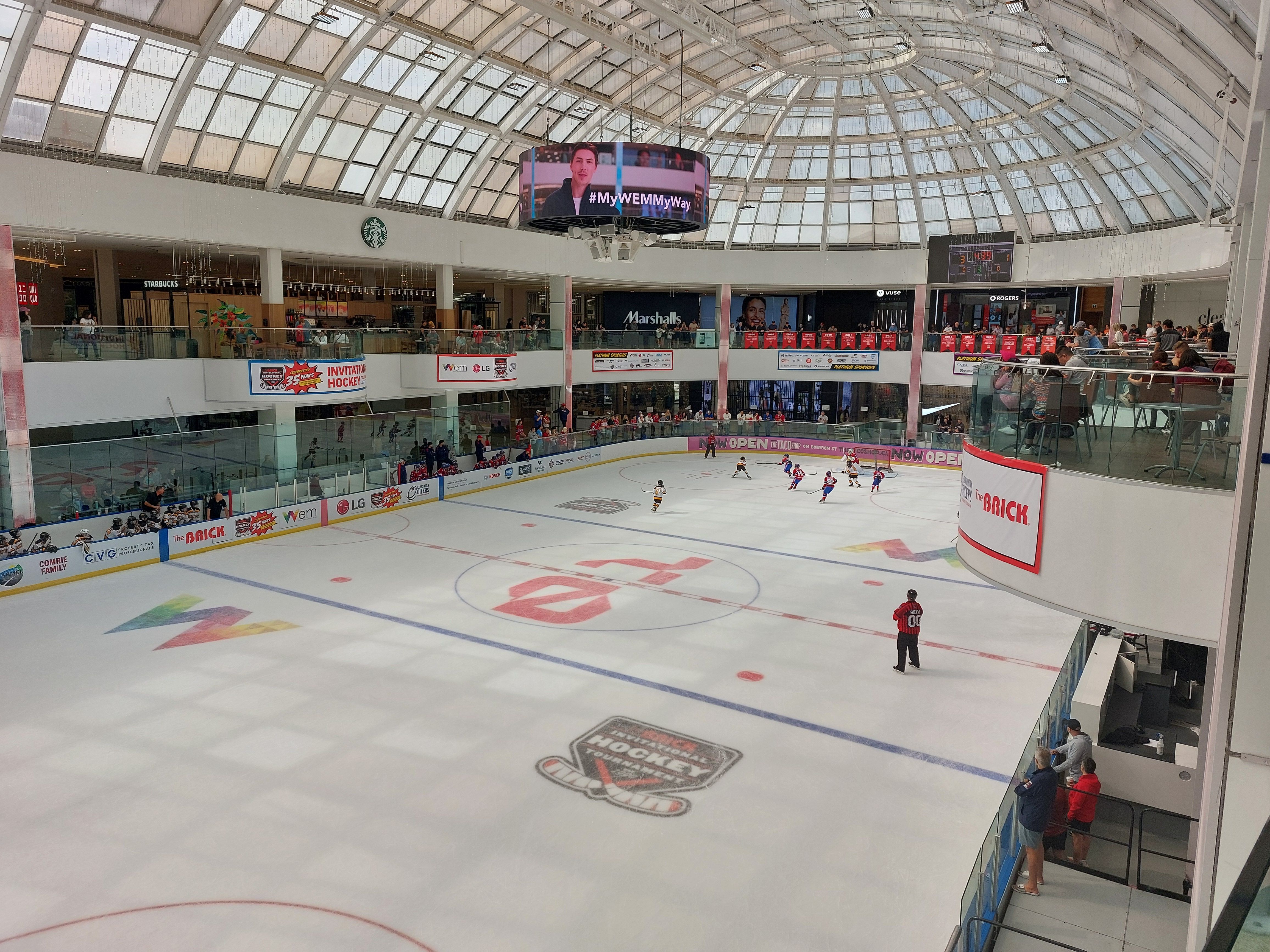 30jun24 - ice rink in a shopping mall, the kids playing are pretty dang great